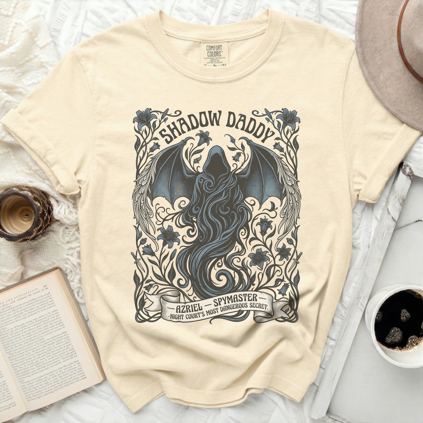 Cream t-shirt with "Shadow Daddy Azriel Spymaster" text and dark winged figure.