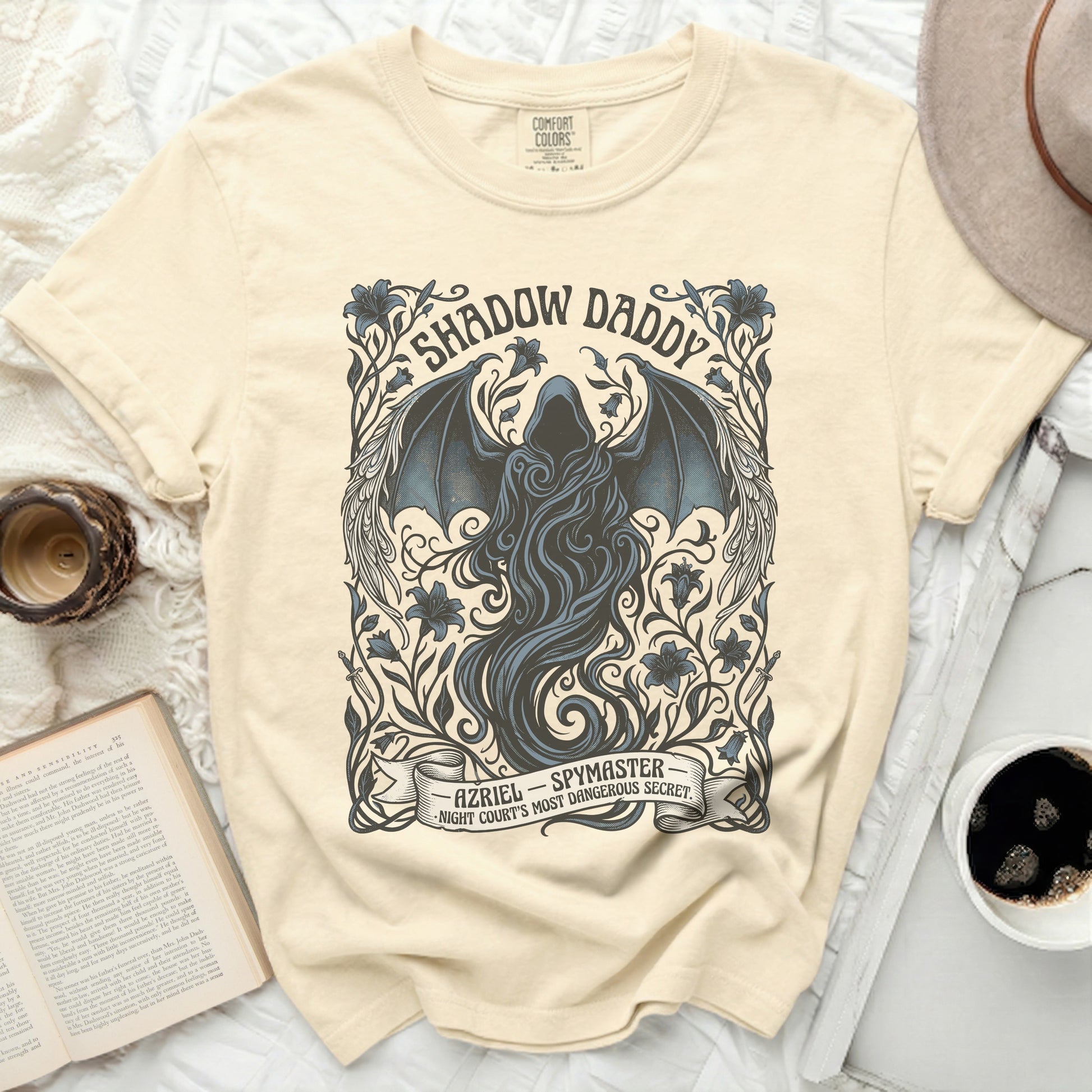 Cream t-shirt with "Shadow Daddy Azriel Spymaster" text and dark winged figure.