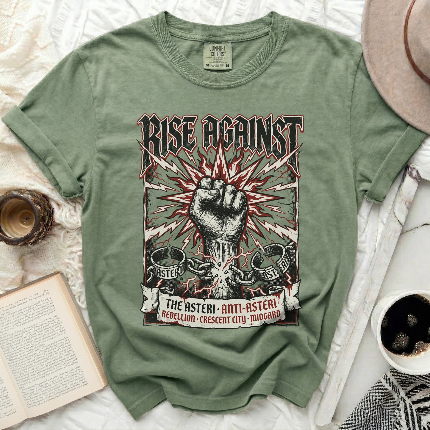 Green t-shirt with "RISE AGAINST" and a clenched fist graphic.