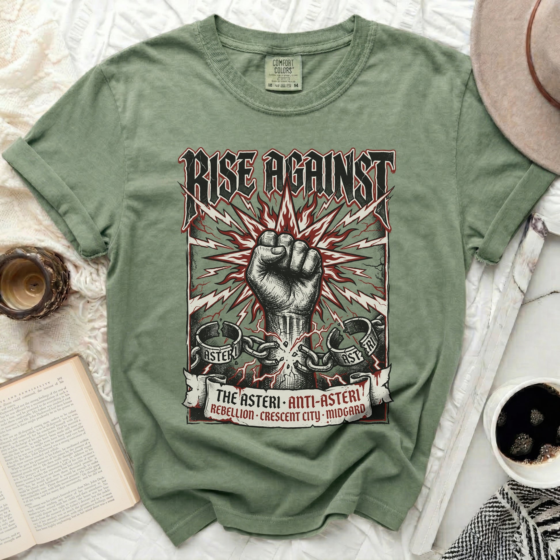 Green t-shirt with "RISE AGAINST" and a clenched fist graphic.