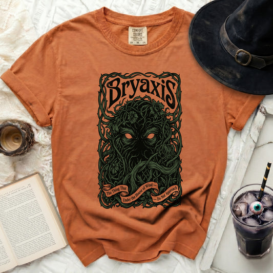 Orange t-shirt with "Bryaxis" and vine graphic and quote.