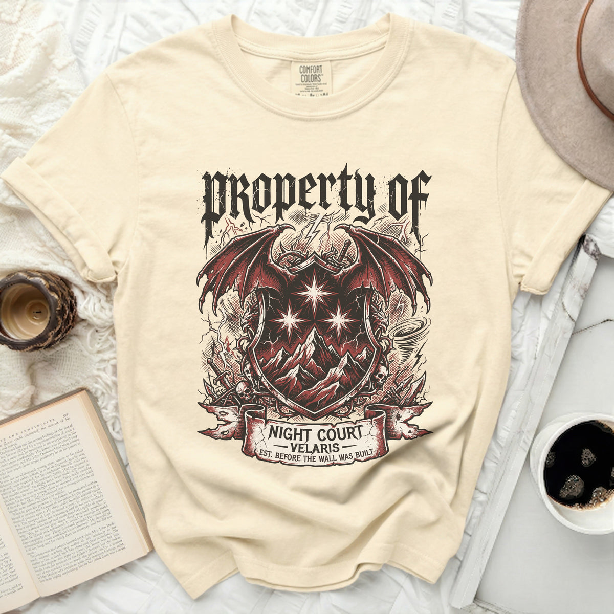 Cream t-shirt with a "Property of Night Court Velaris" crest design.