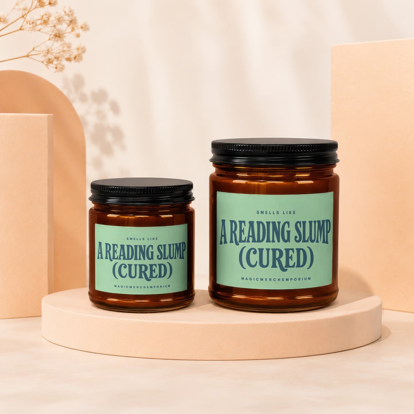 Two candles labeled "Smells Like A Reading Slump (Cured)".
