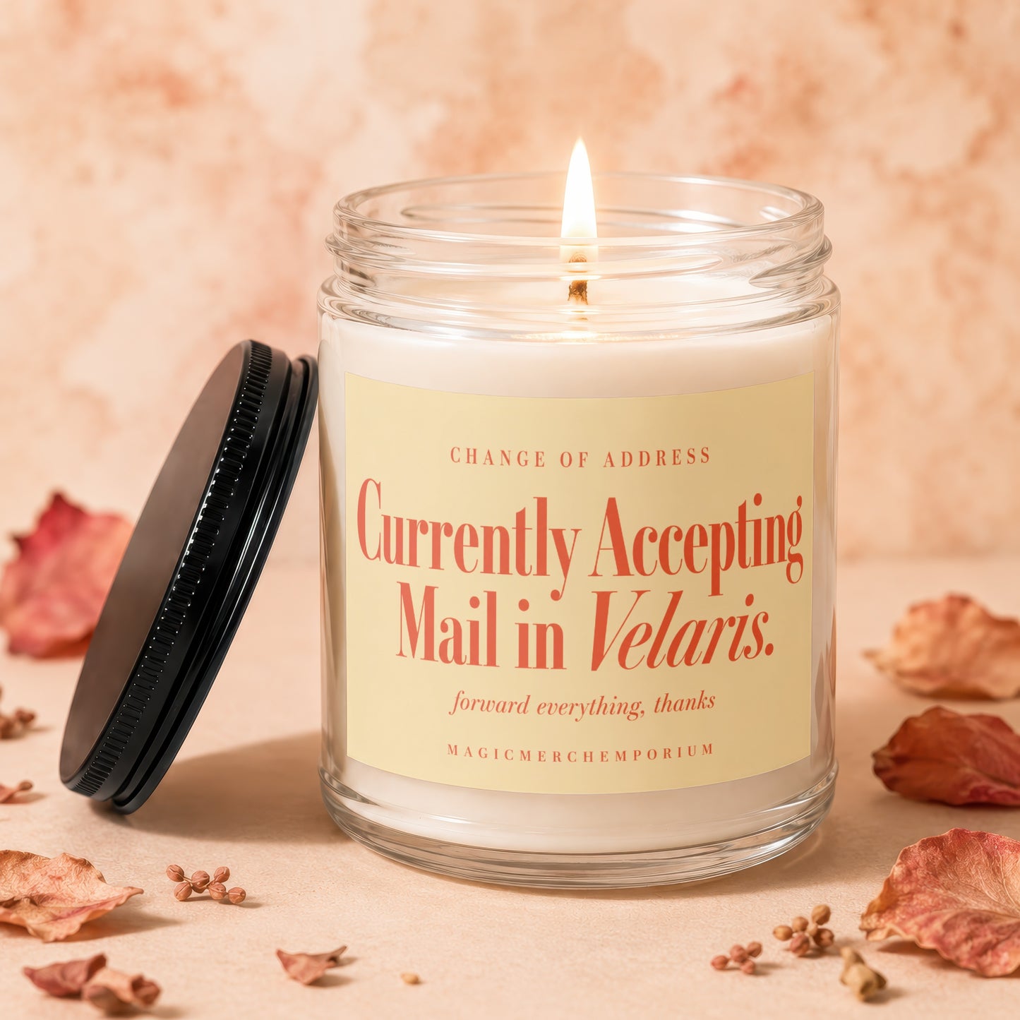 Candle with text "Currently Accepting Mail in Velaris." and "MAGIC MERCHEMPORIUM".