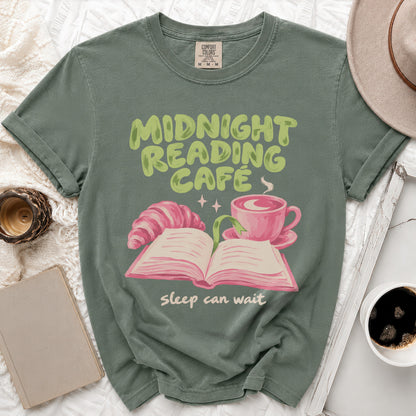 Green t-shirt with "Midnight Reading Cafe" and "sleep can wait" text and illustration.