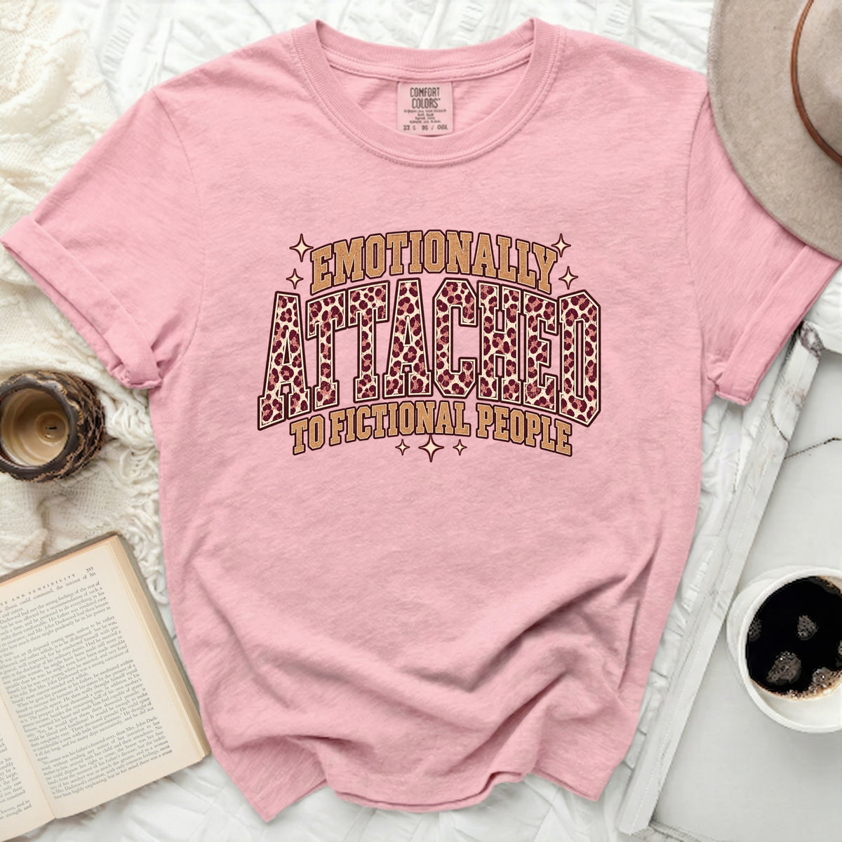 Pink t-shirt with "Emotionally Attached To Fictional People" text and leopard print.