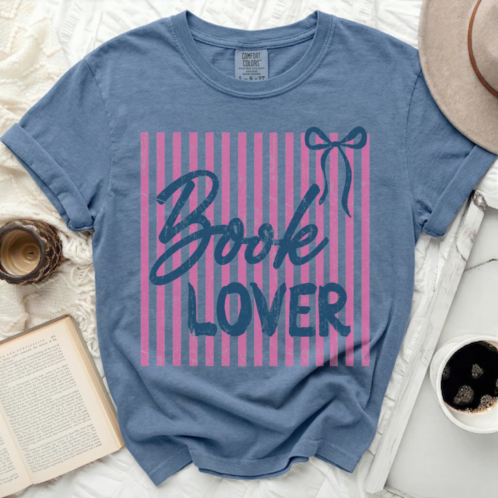 Blue t-shirt with pink stripes and "Book Lover" text.