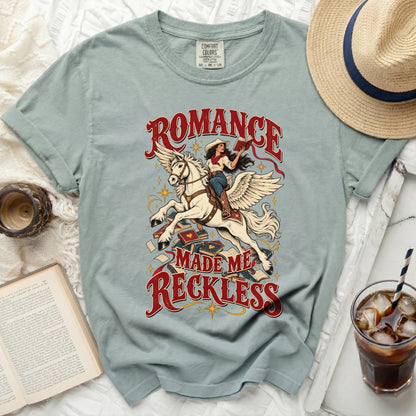 T-shirt with "Romance Made Me Reckless" graphic of a woman riding a winged horse.