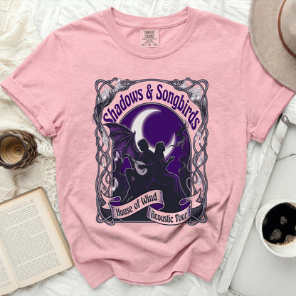 Pink t-shirt with "Shadows & Songbirds" and "House of Wind Acoustic Tour" graphic.