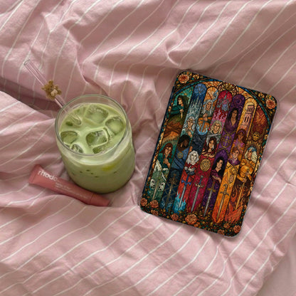 Book cover featuring stained-glass figures and swords with floral borders.