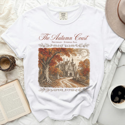 White t-shirt with "The Autumn Court" and a drawing of a gothic mansion in autumn.