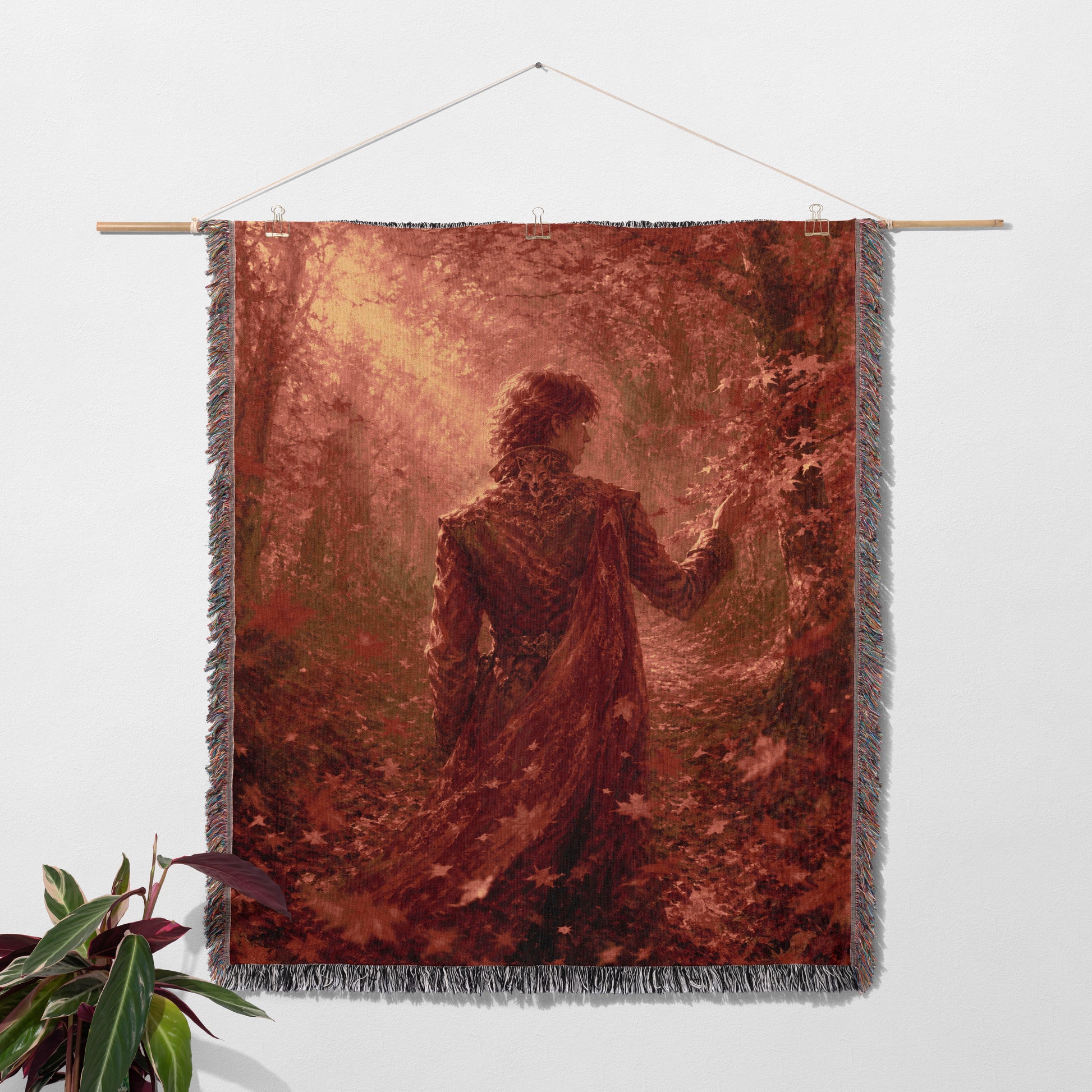 a large tapestry hanging on a wall, depicting a woman standing in a forest with a red and brown color scheme.