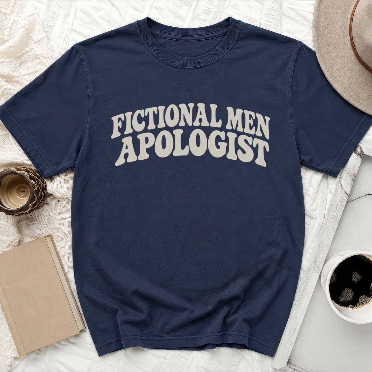 Navy t-shirt with "FICTIONAL MEN APOLOGIST" text.