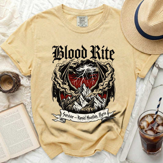 Yellow t-shirt with "Blood Rite Survivor - Ramiel Mountain, Illyria" graphic.