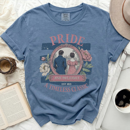 Blue t-shirt with "Pride and Prejudice Est 1813 A Timeless Classic" graphic.