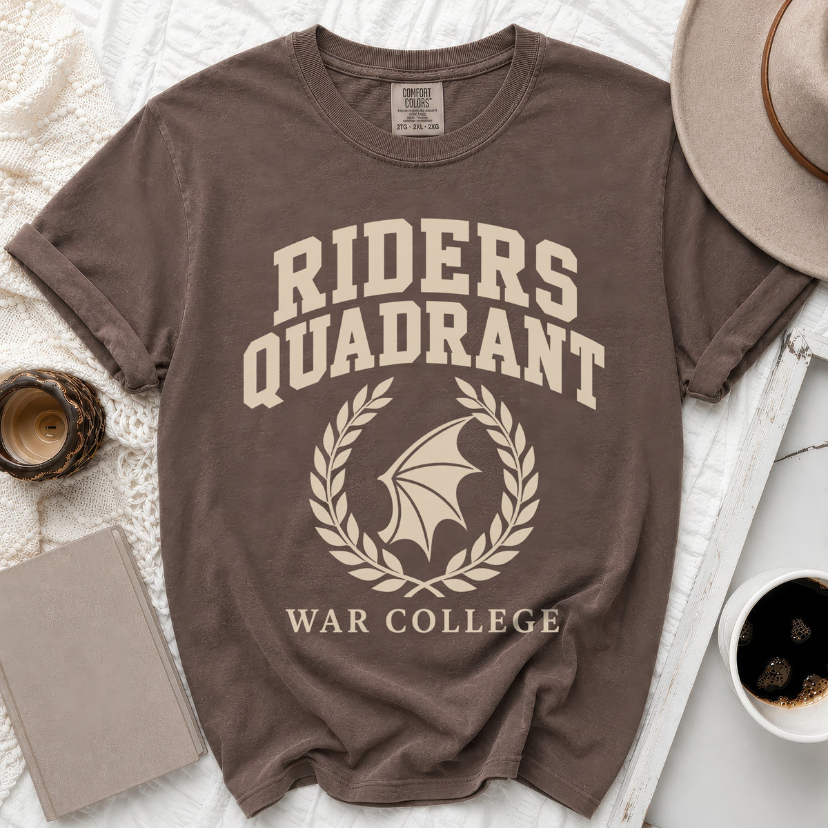 Brown t-shirt with "RIDERS QUADRANT WAR COLLEGE" text and a winged crest.