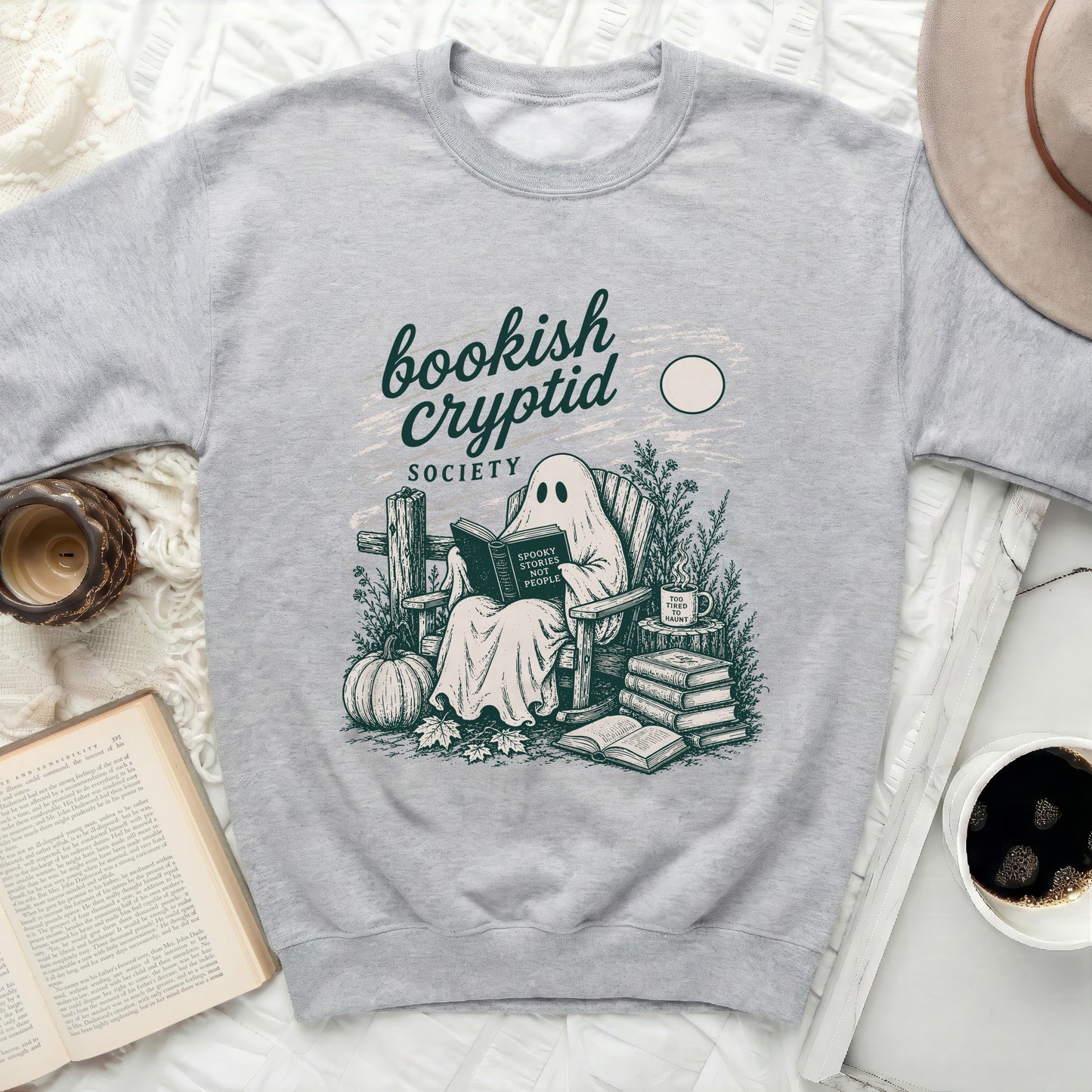 Grey sweatshirt with "Bookish Cryptid Society" text and ghost reading a book.