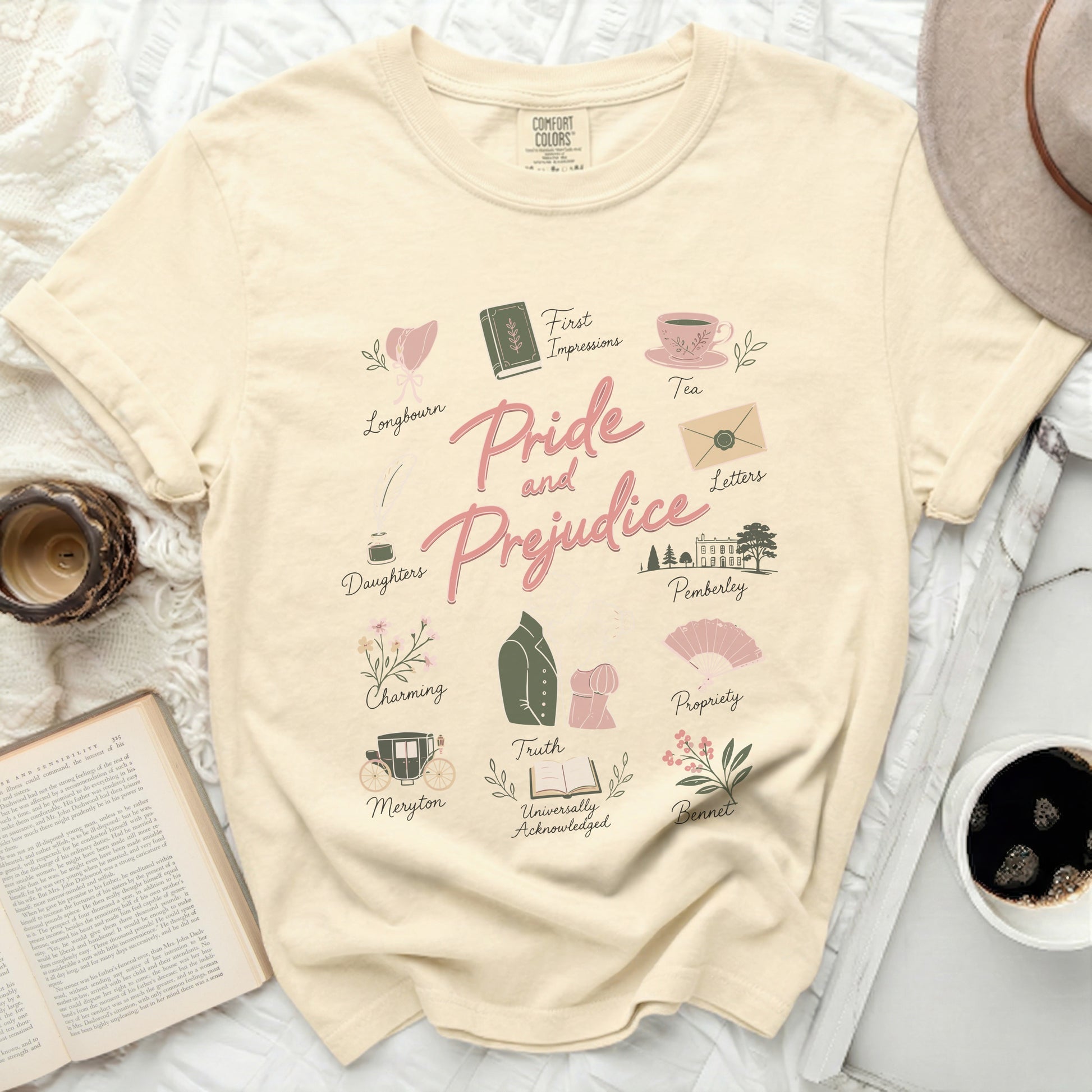 Cream t-shirt with "Pride and Prejudice" and Austen-themed illustrations.