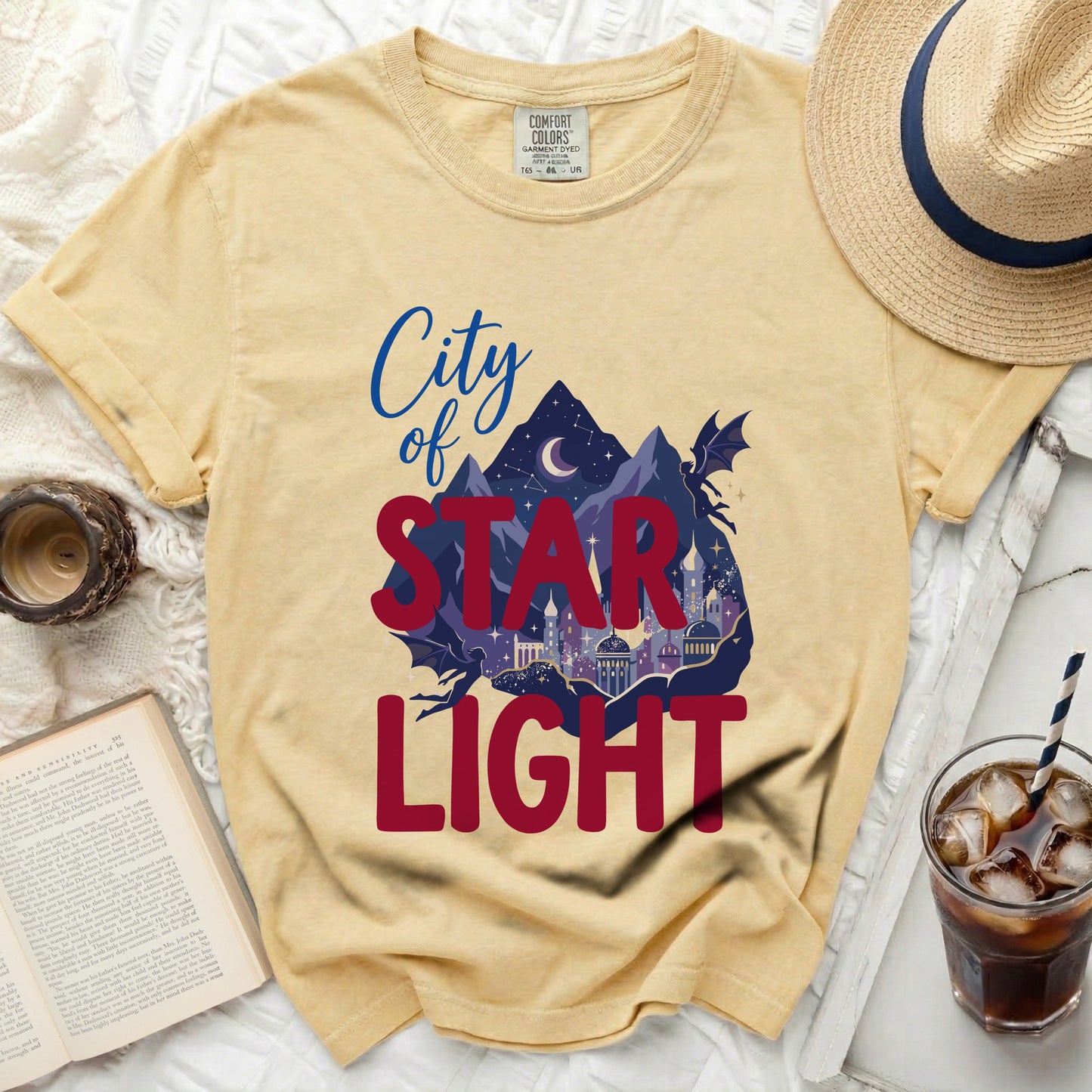 Yellow t-shirt with "City of Star Light" graphic and dragon silhouette.
