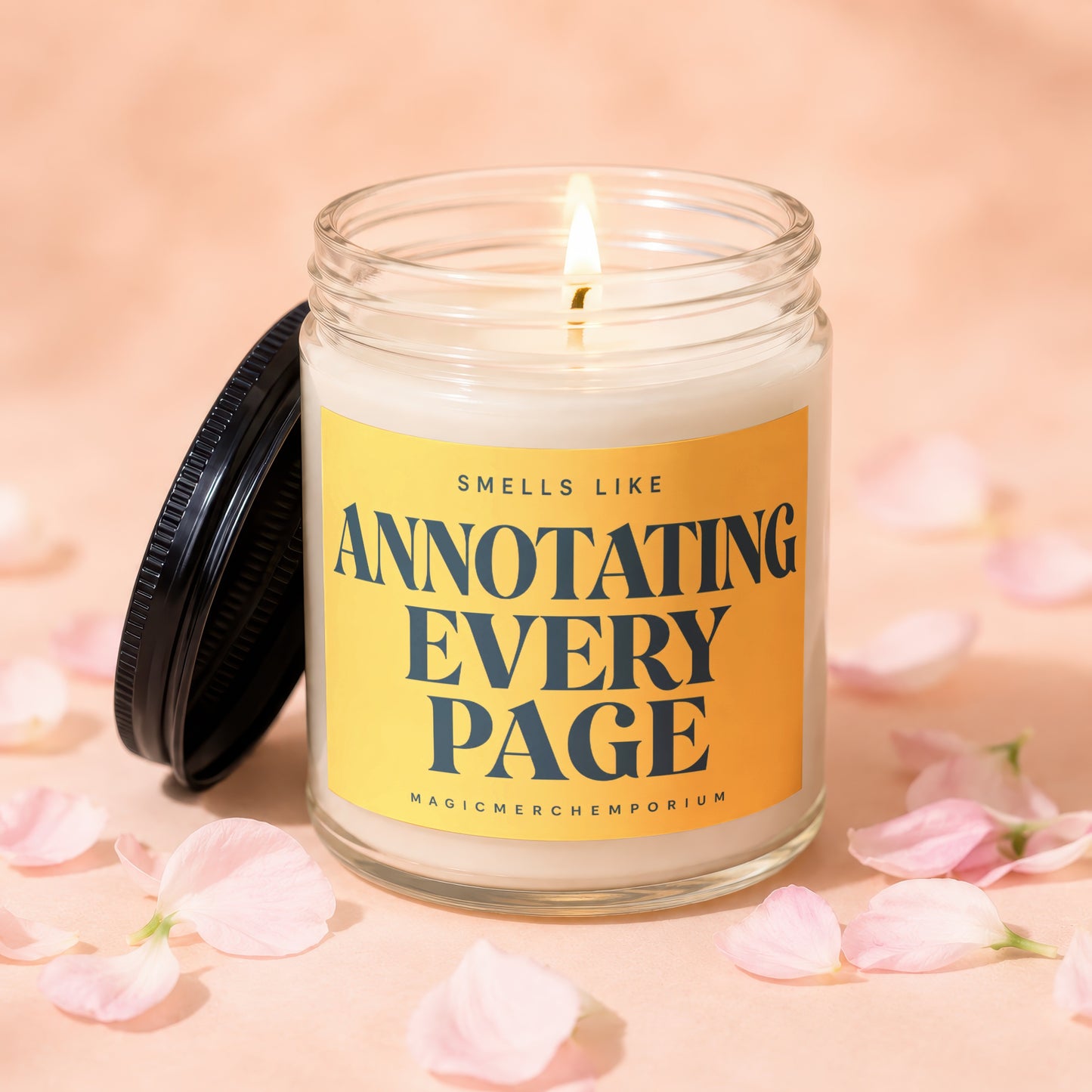 Lit candle in glass jar with yellow label that reads "Smells Like Annotating Every Page".
