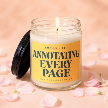 Lit candle in glass jar with yellow label that reads "Smells Like Annotating Every Page".