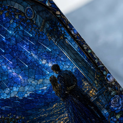 Couple embraces under a starry sky with shooting stars in stained glass design.