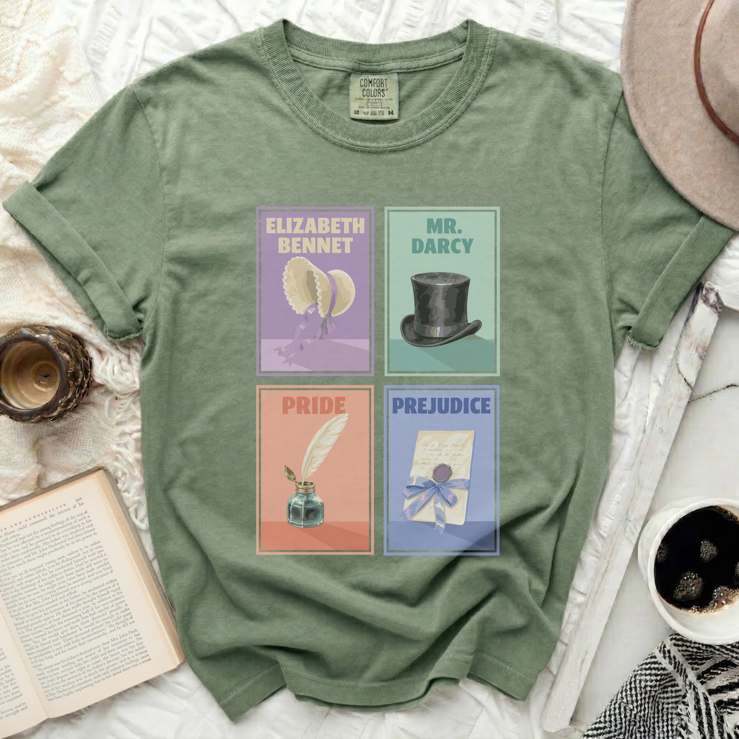 Green t-shirt with "Pride and Prejudice" graphic featuring Elizabeth Bennet, Mr. Darcy, Pride, and Prejudice panels.