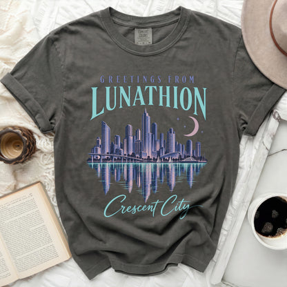 T-shirt with "Greetings from Lunathion Crescent City" text and city skyline graphic.