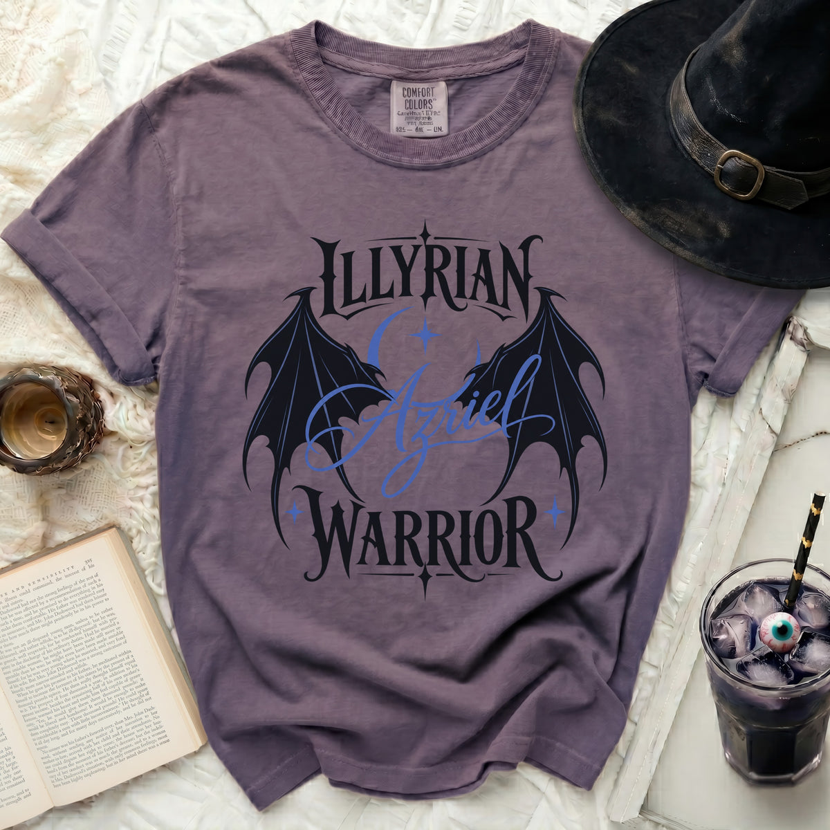 Purple Comfort Colors t-shirt with "Illyrian Azriel Warrior" graphic and wings.