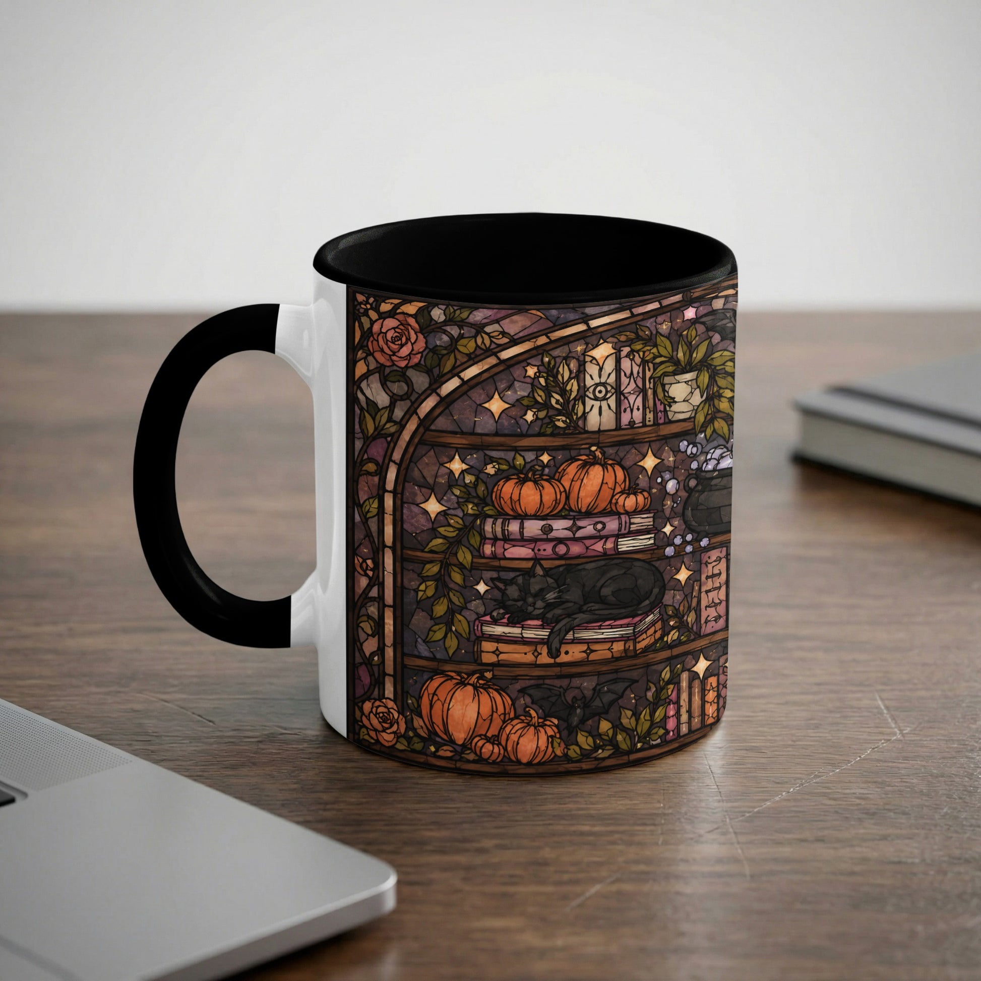 White mug with black handle featuring stained glass art of a black cat, pumpkins, and books.