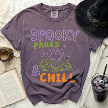 Purple shirt with "Spooky Pages & Chill" Halloween ghost graphic.