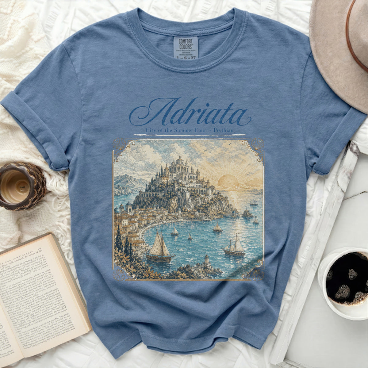 Blue t-shirt with "Adriata City of the Summer Court Prythian" and coastal city scene.