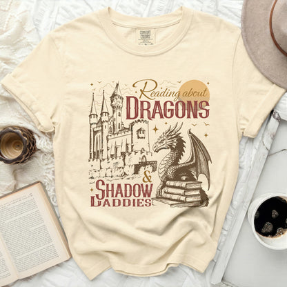 Comfort Colors t-shirt with "Reading about Dragons & Shadow Daddies" graphic.