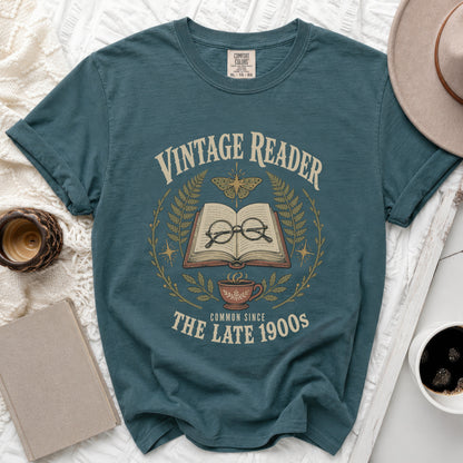Teal t-shirt with "Vintage Reader Common Since The Late 1900s" graphic.