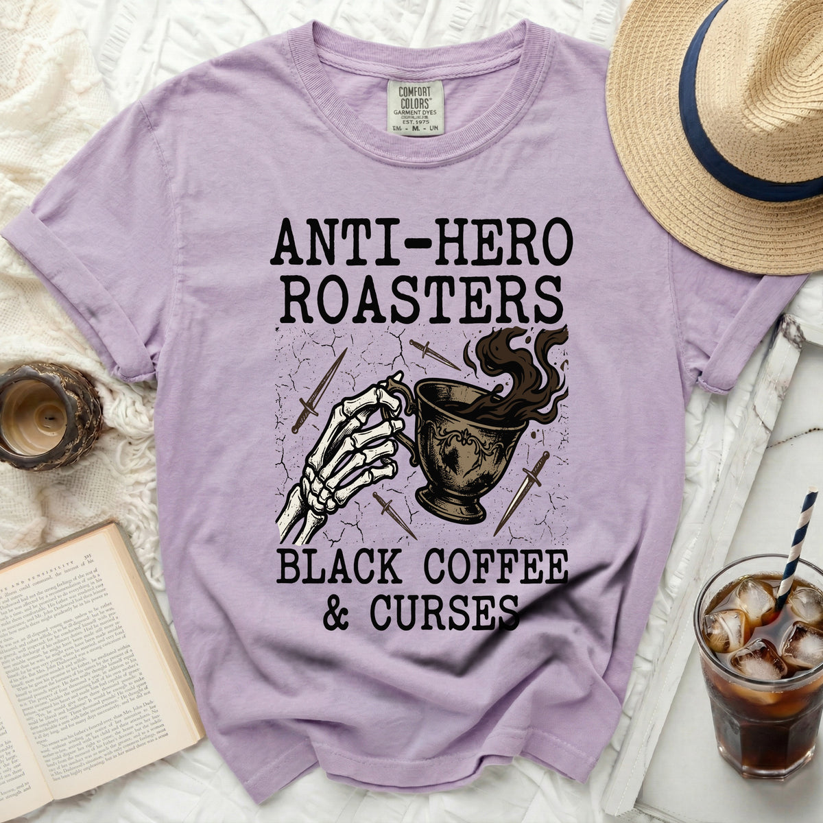Purple t-shirt with "Anti-Hero Roasters Black Coffee & Curses" graphic.