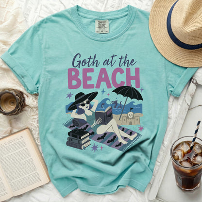 Comfort Colors t-shirt with "Goth at the Beach" and Dracula reading by the sea.