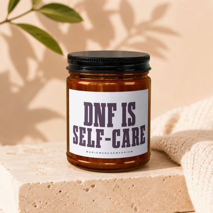 Amber jar candle with black lid, text reads "DNF IS SELF-CARE".