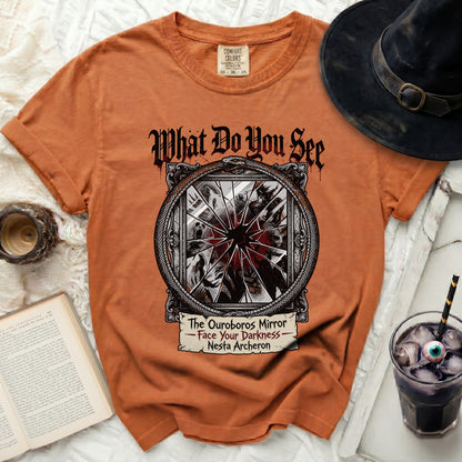 Orange t-shirt with "The Ouroboros Mirror - Face Your Darkness - Nesta Archeron" graphic.
