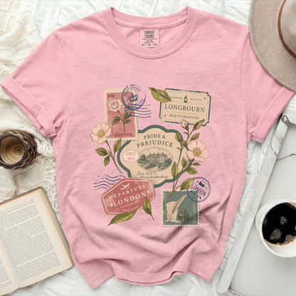 Pink t-shirt with vintage stamp designs featuring Pride and Prejudice quotes and floral illustrations.