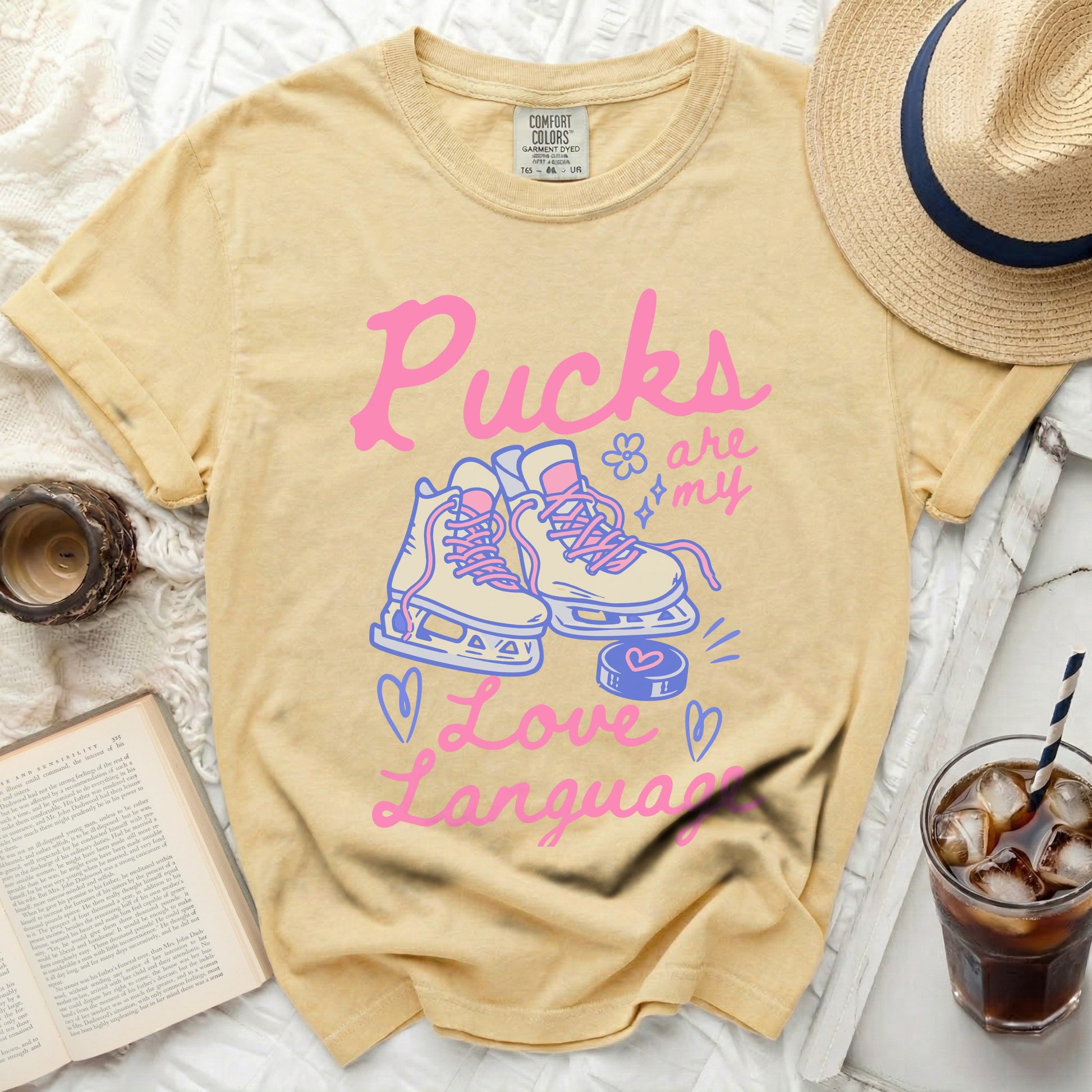 Yellow t-shirt with "Pucks are my Love Language" and ice skates graphic.