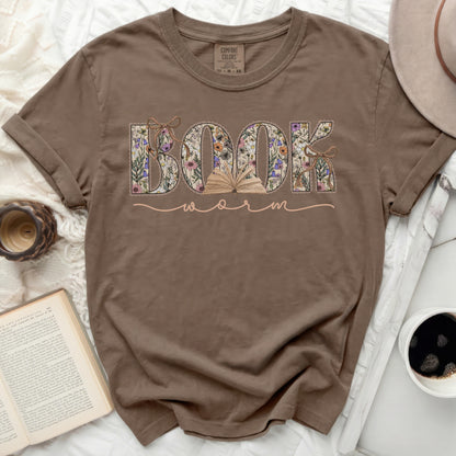 Brown t-shirt with "BOOK WORM" in floral letters and an open book.