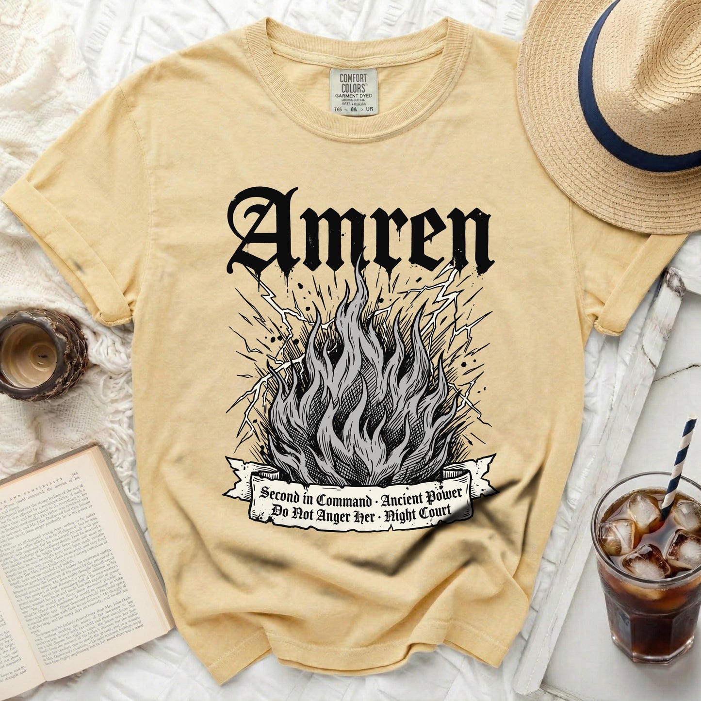 Yellow t-shirt with "Amren" and fiery graphic.