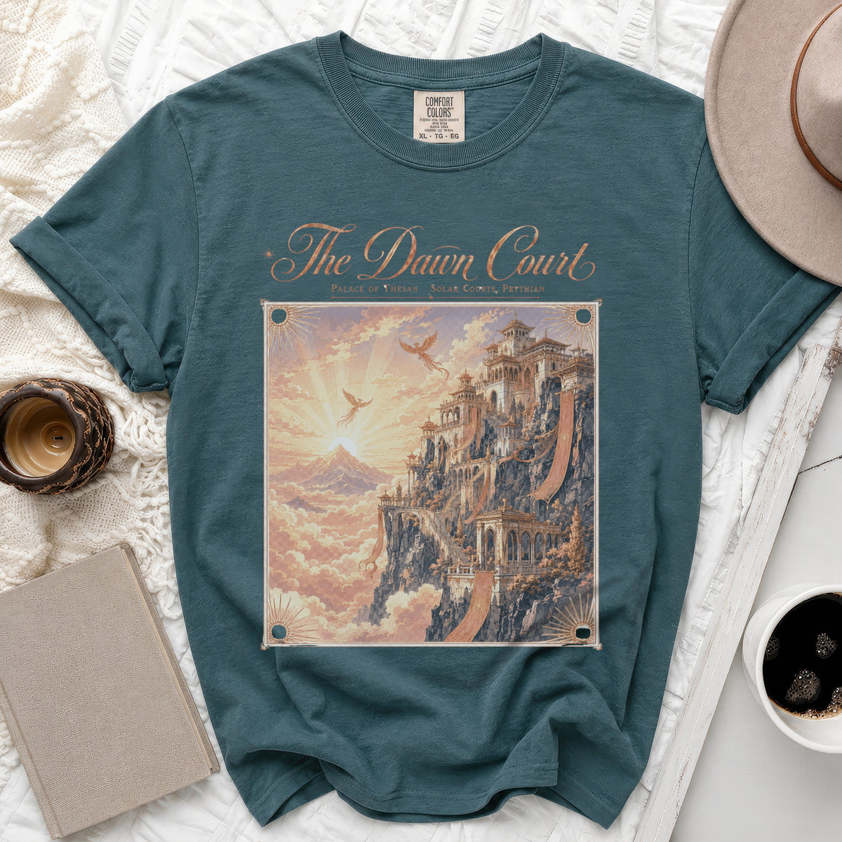 Teal t-shirt with "The Dawn Court Palace of Thesan Solar Courts, Prythian" graphic.