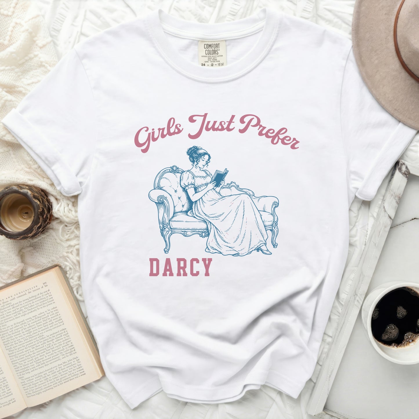 White t-shirt with "Girls Just Prefer Darcy" and illustration.