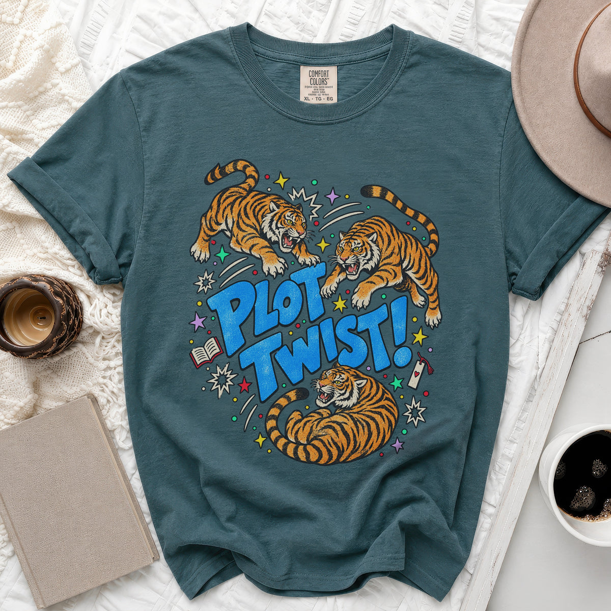 Teal t-shirt with tigers and "PLOT TWIST!" text graphic.