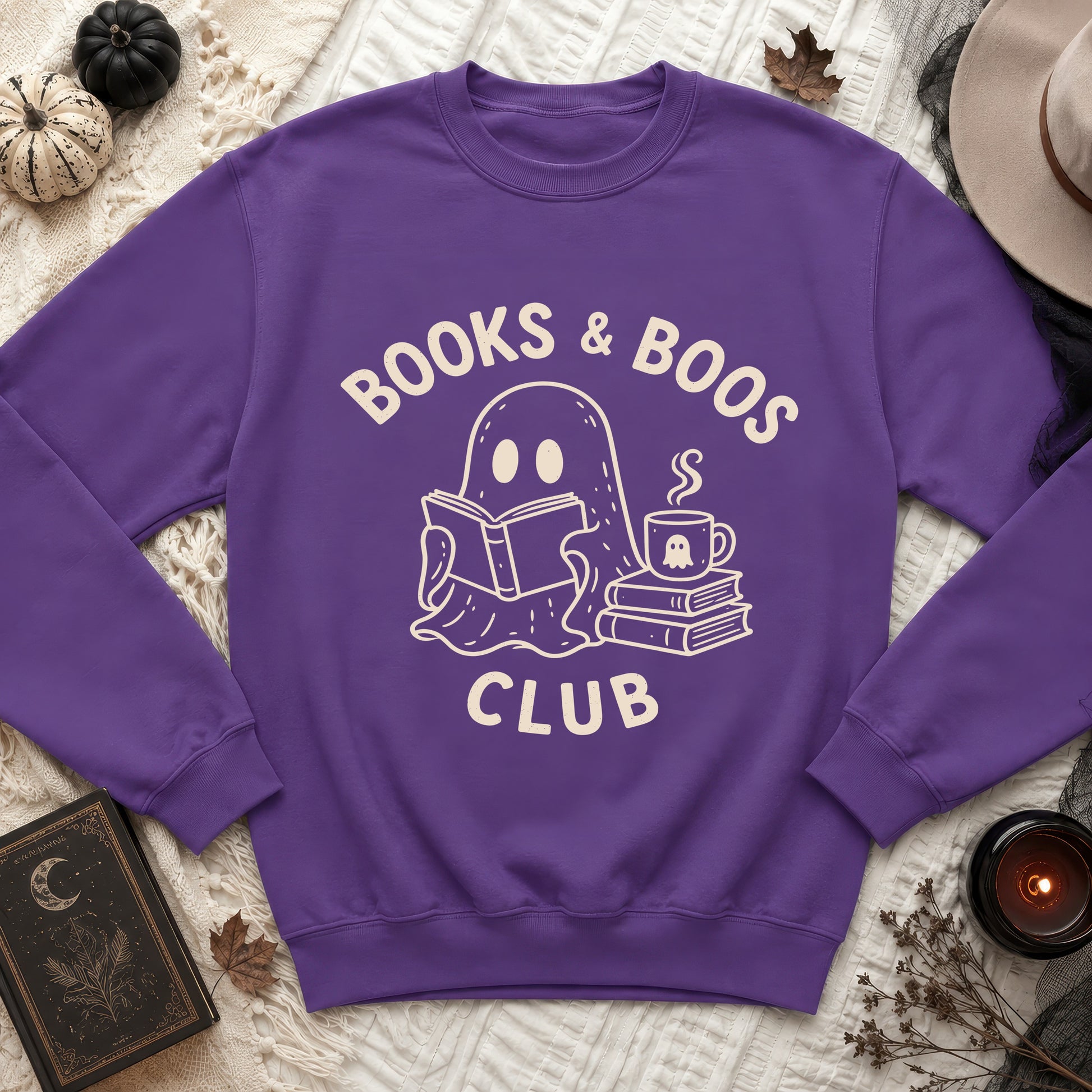 Purple sweatshirt with "Books & Boos Club" text and ghost reading a book.