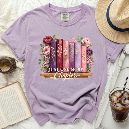 Lavender t-shirt with floral books and "Just One More Chapter" text.