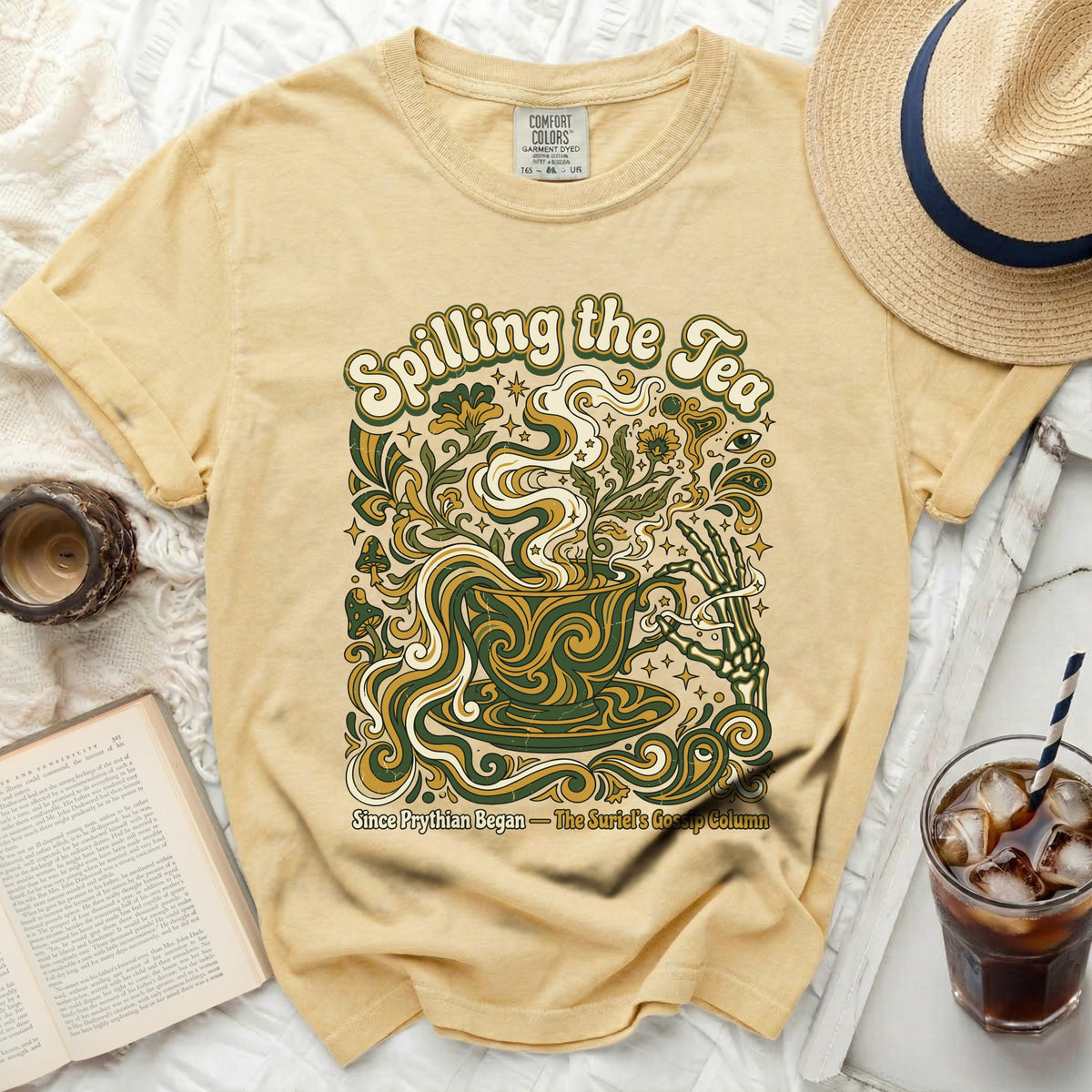 Yellow t-shirt with "Spilling the Tea" graphic and floral design.