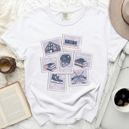 White t-shirt with stamp-style graphics about romance tropes and hockey.