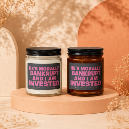 Two candles with "He's Morally Bankrupt And I Am Invested" text.